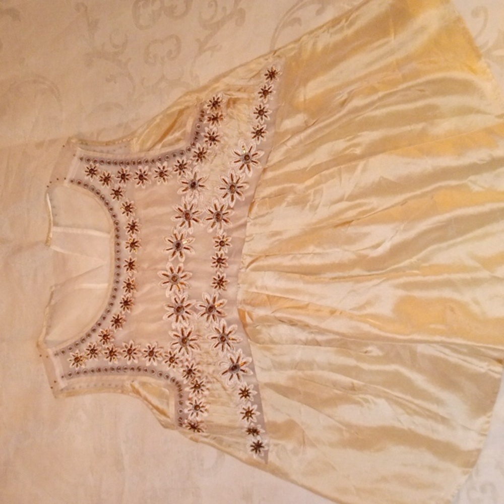 Cream/beige beautifully beaded silk blouse with see through detail.